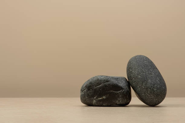 istock Background for cosmetics, stones and tree bark on beige background 2203757794