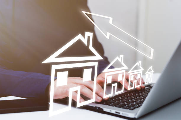 istock Businessman using laptop with drawing house on screen. Real estate concept 2203758021
