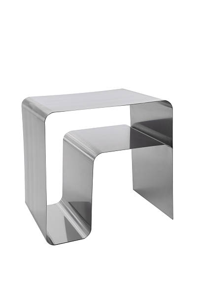 istock Modern minimalist metal side table with a sleek, curved design, isolated on a white background, perfect for contemporary interior decor. 2203758370