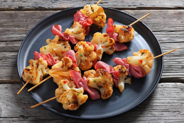 istock spicy cauliflower kebabs with corned beef on plate 2203758802