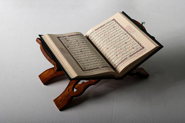 istock Open Quran on Wooden Stand 2203759788