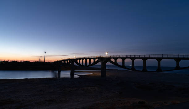 istock Beautiful sky and silhouette of a bridge before dawn 2203762577