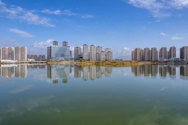 istock The urban architectural complex by the lake is reflected in the water 2203766790