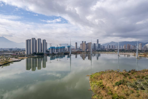 istock The urban architectural complex by the lake is reflected in the water 2203766818