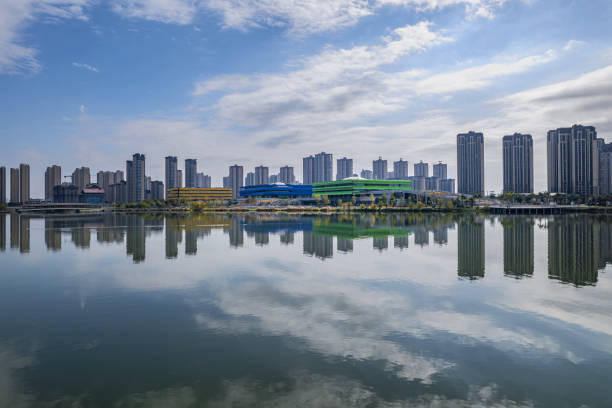 istock The urban architectural complex reflected by the lake water 2203766937
