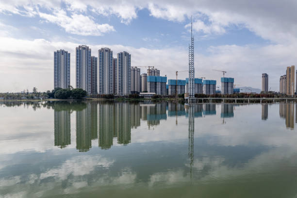 istock The urban architectural complex reflected by the lake water 2203766943
