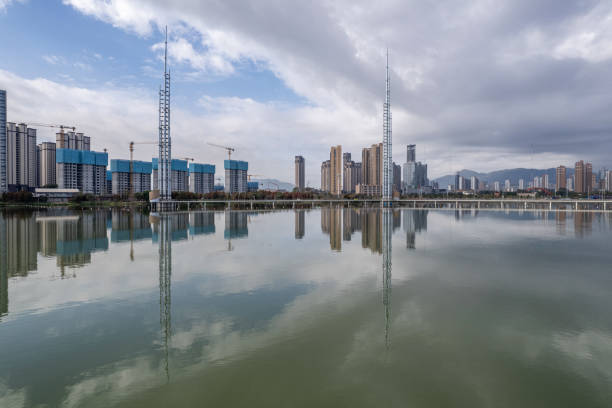 istock The urban architectural complex reflected by the lake water 2203766944