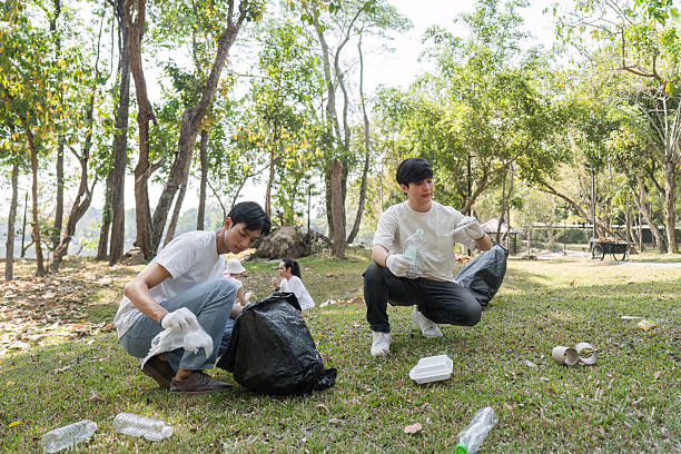 istock Volunteers engaging in a community cleanup, promoting sustainability and environmental awareness. 2203770042