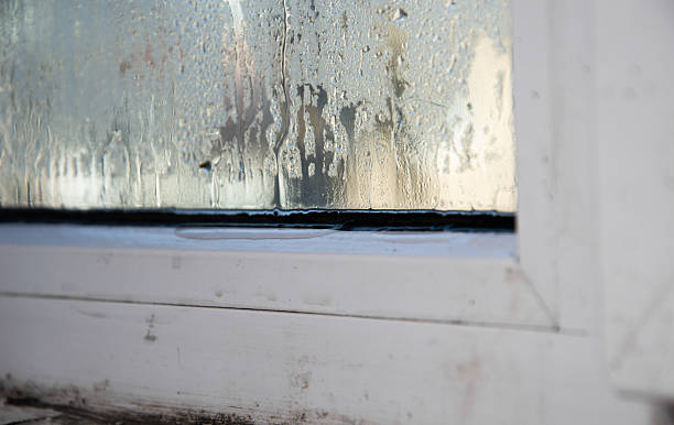 istock water drips from the glass of a plastic window. 2203770371