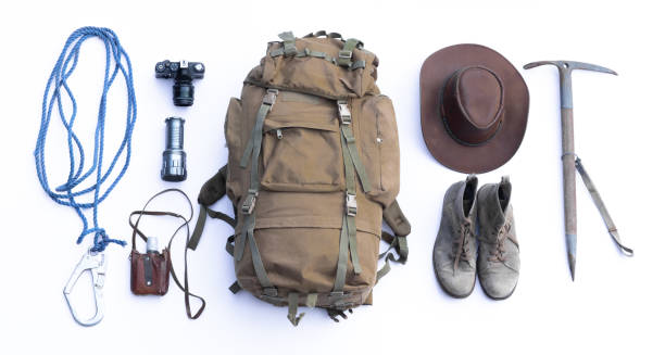 vintage mountain canvas travel backpack and accessories isolated on white background