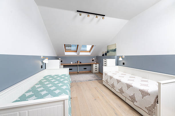 istock A bedroom with two twin beds and a desk 2203773228