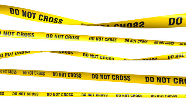 istock Set of yellow do not cross caution tapes warning about danger 2203774661