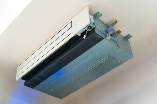 istock A ceiling-mounted air conditioning unit is installed in a modern room. It features sleek lines and efficient design, showcasing both functionality and aesthetics 2203774934