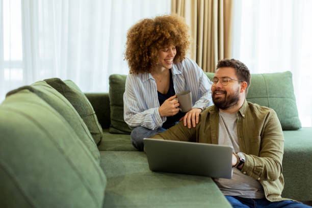 istock Engaging conversation sparks creativity between two friends in a cozy living room setting 2203774993