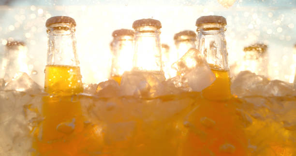 istock Golden Soda Bottles in Ice with Sunset Glow 2203775638