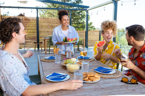 istock Friends enjoying a summer outdoors on a house patio 2203776007