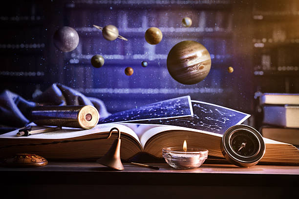 istock Concept of knowledge of universe with book planets and library 2203777221