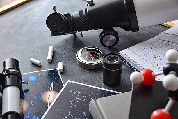 istock Material books and telescope for study of astronomy on blackboard 2203777226