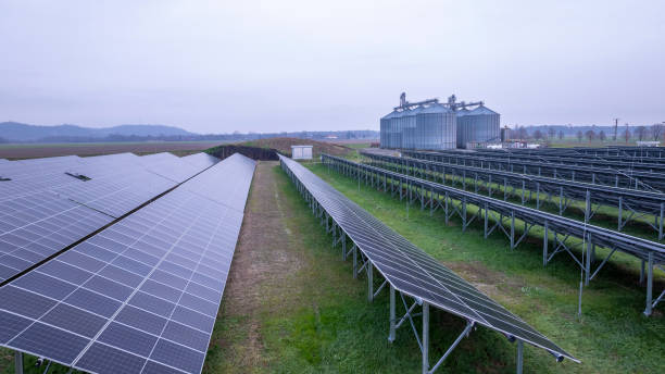 istock Expansive Solar Panels Beside Rural Silos 2203778909