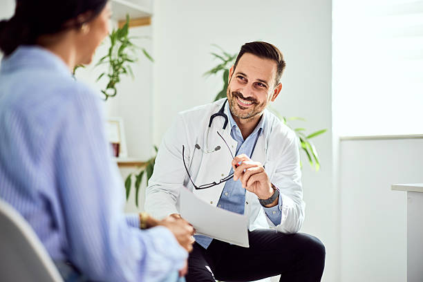 istock Friendly Doctor Discussing Patient's Health During a Checkup Appointment 2203780539