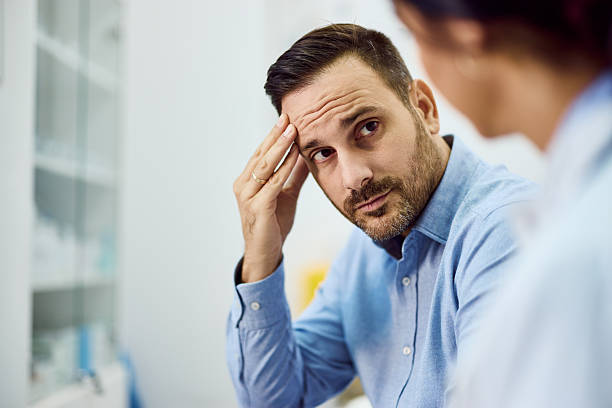 istock Concerned Man Consulting With a Professional in a Modern Interior Setting 2203780547