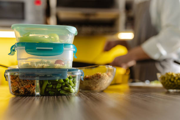 istock Prepared meals stored in reusable containers on a wooden kitchen countertop 2203781154