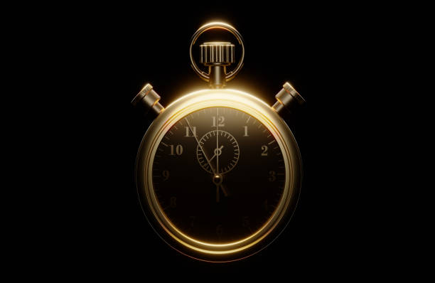 Gold colored stopwatch on black background. Horizontal composition.