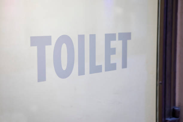 Selective focus of Push sign on the white door of the seminar room.