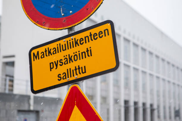 Close-up of a written notice in a series of road works signs