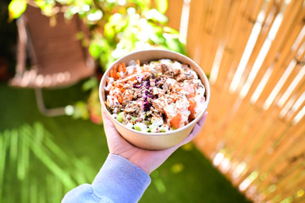 istock Eating delicious poke in a sunny day. 2203783734