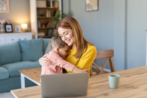 istock Caring mother hugs child tightly in a cozy home setting 2203783930