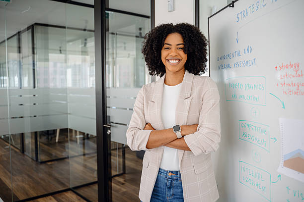 istock A diverse group of professionals in a modern office celebrates success with a high-five 2203784050