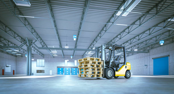istock Forklift carrying wooden pallets in distribution warehouse 2203785144