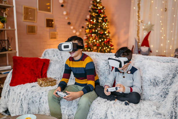 istock Two Boys Playing Video Games On A Joystick While Wearing Virtual Reality Headset At Home During Christmas Holidays 2203787982