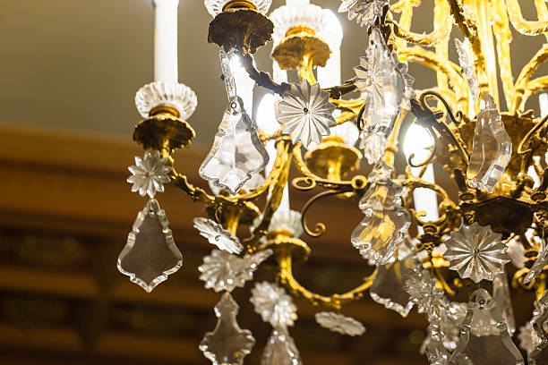 istock A beautifully ornate chandelier featuring golden metalwork 2203789410