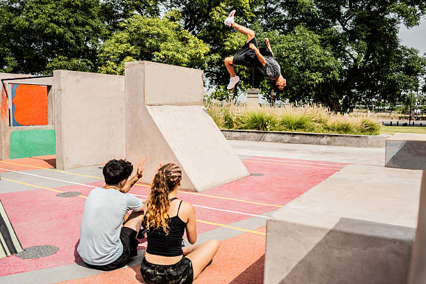 Free running athlete man practicing parkour in a public park