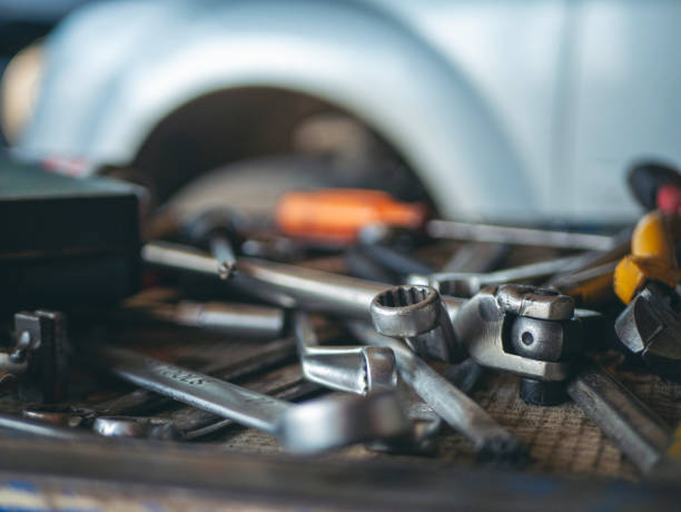 istock Mechanic tools engineering equipment car auto repair shop with copy space. Blurred background mechanical service. Heavy screw grungy rusted wrenches dirty screwdriver object. Industrial hardware set 2203790985