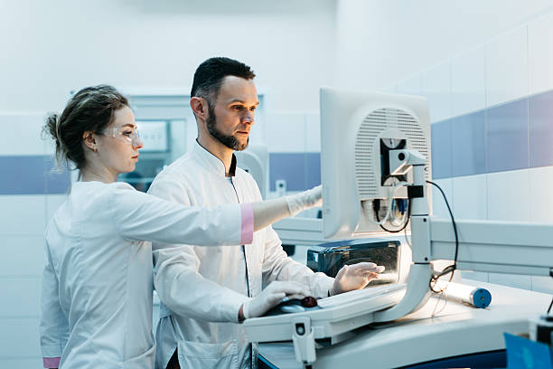 istock A group of scientists conducts biochemical research in a modern laboratory. 2203791163