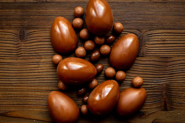 istock A pile of chocolate eggs and candies, top view. Chocolate background 2203792198