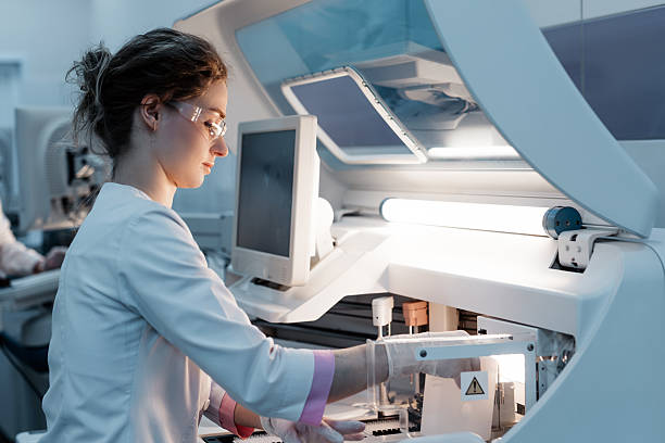 istock A scientist works with high-tech equipment in a modern laboratory, analyzing biological material and conducting experiments. 2203793211