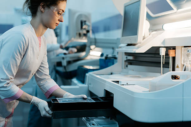 istock A young woman works in a modern laboratory with advanced equipment and an analyzer. 2203793482