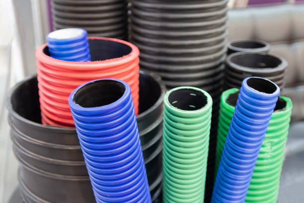 Plastic corrugated pipes of different colors. Industry
