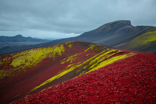 The Apple Crater, locally known as Raudaskal (“red bowl” in Icelandic), is a breathtaking volcanic formation in Iceland's highlands. This striking crater captivates with its deep red volcanic soil, contrasted by vibrant green moss that thrives on its slopes. The nickname \