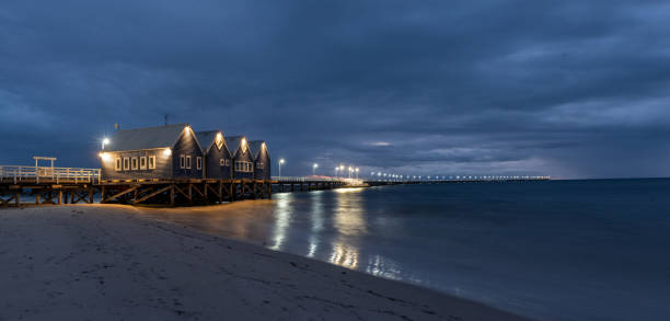 istock Busselton jetty on overcast night with lights and long exposure 2203800046