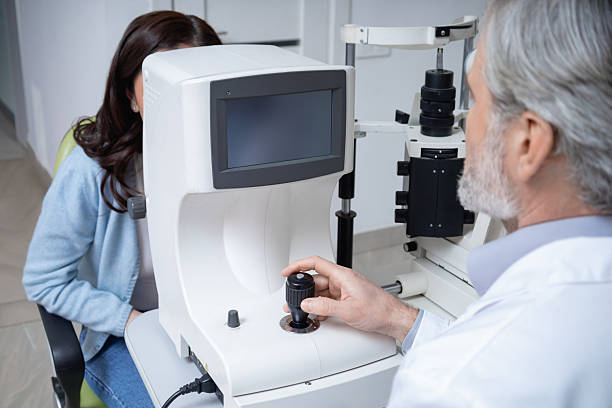 istock Woman visiting optical clinic for eyesight test with ophthalmologist 2203801313