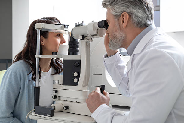 istock Woman visiting optometry center for lens examination with oculist 2203801350