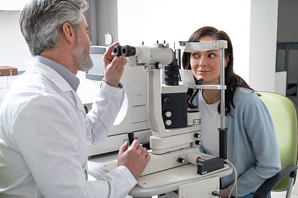 istock Woman visiting optometry center for lens examination with oculist 2203801355