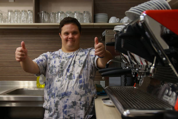 istock Young man working in coffee shop 2203801431