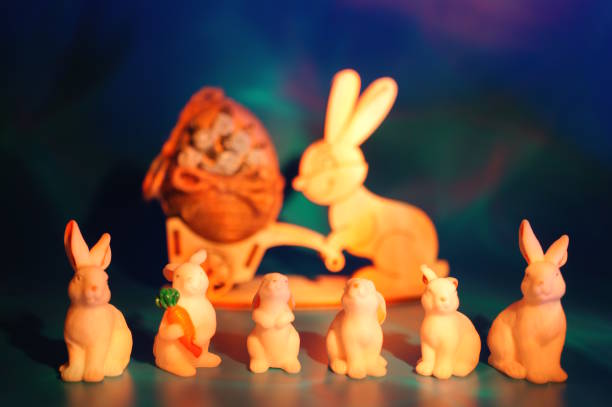 Toy rabbits on a colorful background. Decorations for Easter.