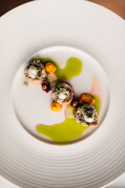 Carp, apples and herbs on a plate